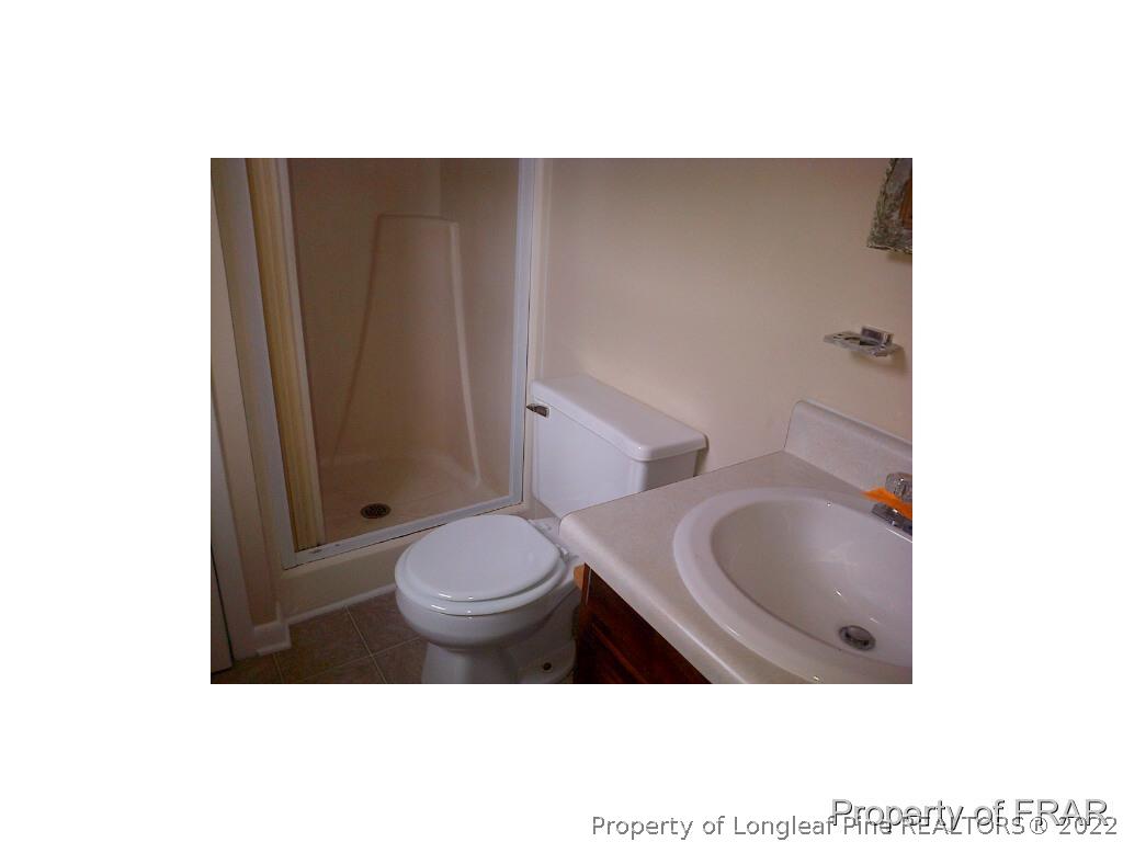 2121 Bainbridge Road Stedman, NC 28391 - Photo 10 of 16 a bathroom with a toilet
