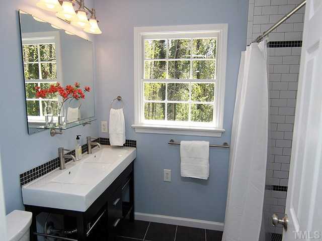 3722 Eton Road Durham, NC 27707 - Photo 17 of 25 Updated Master Bathroom with walk-in tile shower, new Vanity and Tile Floor.