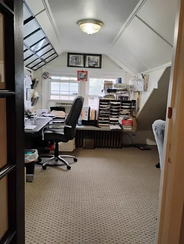 a view of a livingroom with furniture and windows