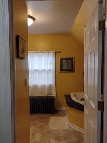 a bathroom with a tub and a shower