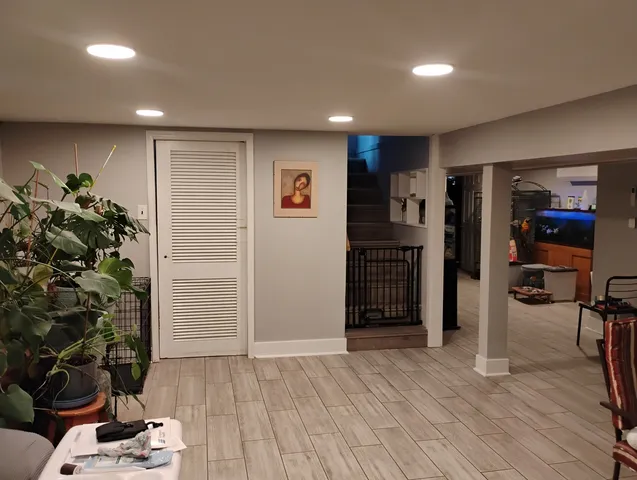 a view of a livingroom with furniture and an empty room