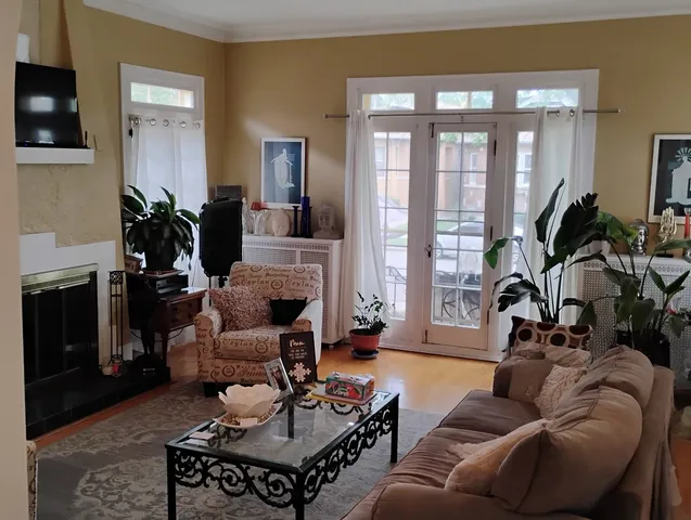 a living room with furniture fireplace and a flat screen tv