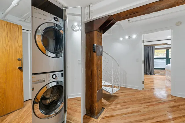 a view of a hallway with washer and dryer