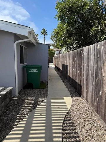 a view of a room with a table and chairs