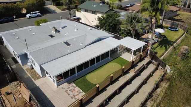 an aerial view of a house with a big yard