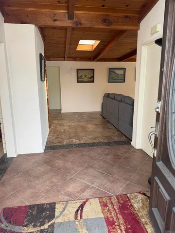 a view of entry way with wooden floor