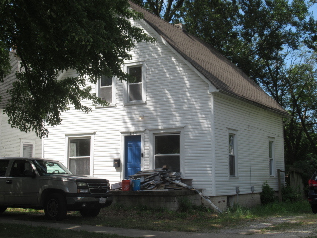 210 West Charles Street Champaign, IL 61820 - Photo 2 of 11 a front view of a house with a yard