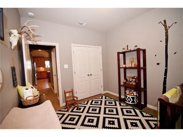 a bedroom with a bed and a view of bathroom