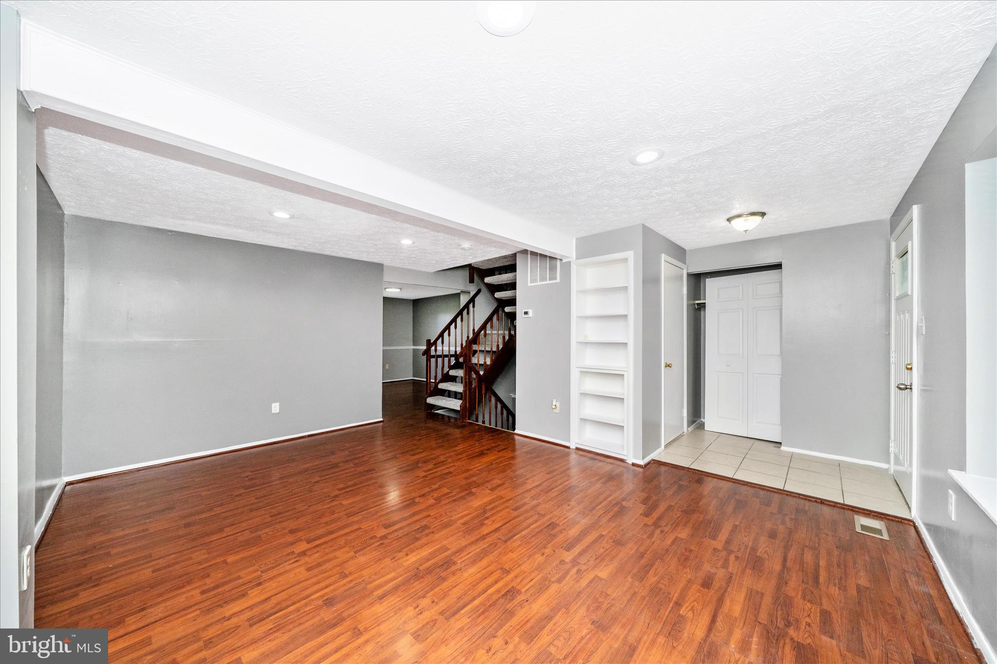 3749 Castle Terrace, Unit 12114 Silver Spring, MD 20904 - Photo 5 of 51 a view of an empty room with wooden floor
