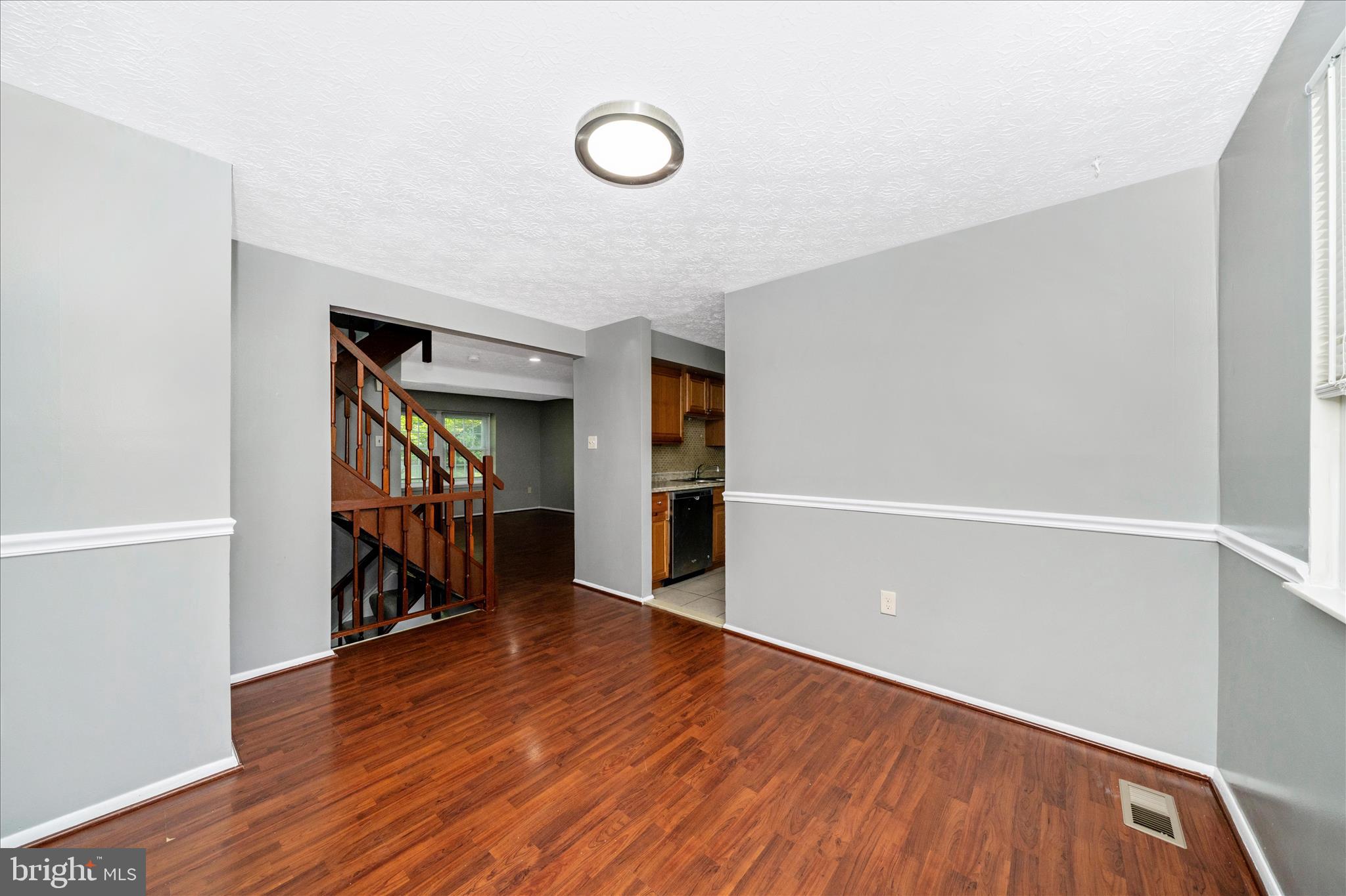 3749 Castle Terrace, Unit 12114 Silver Spring, MD 20904 - Photo 10 of 51 a view of a hallway with wooden floor and closet