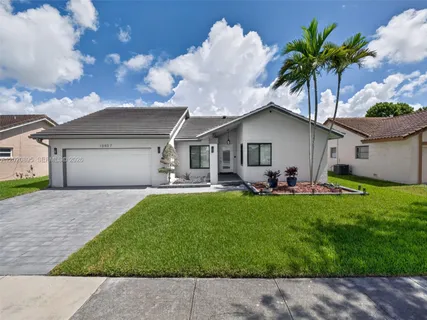 a front view of house with yard and outdoor seating