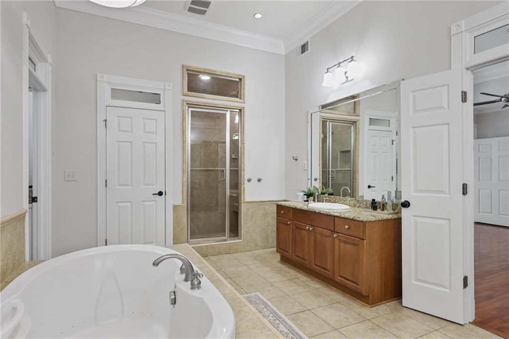 7680 Ryefield Drive Atlanta, GA 30350 - Photo 20 of 49 a spacious bathroom with a tub sink and mirror