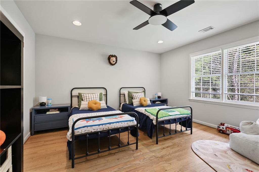 7680 Ryefield Drive Atlanta, GA 30350 - Photo 23 of 49 a bedroom with furniture and a window