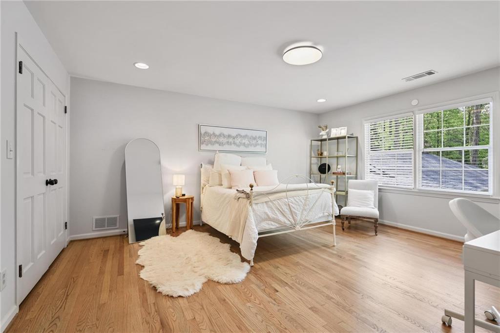 7680 Ryefield Drive Atlanta, GA 30350 - Photo 26 of 49 a bed room with a bed and a chair