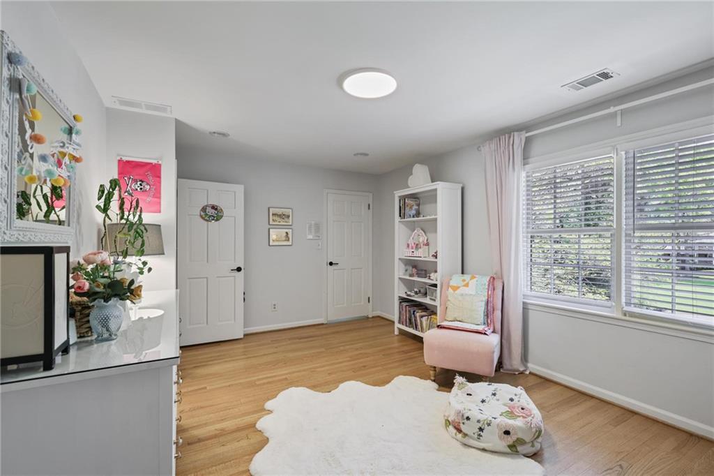 7680 Ryefield Drive Atlanta, GA 30350 - Photo 29 of 49 a bedroom with furniture and a large window
