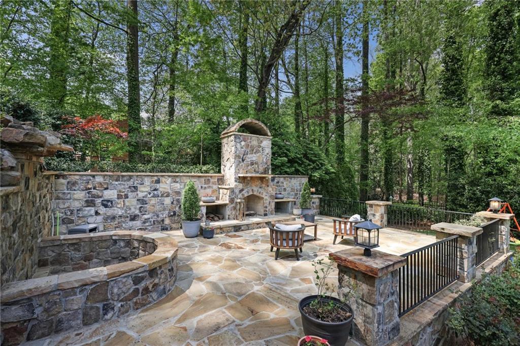 7680 Ryefield Drive Atlanta, GA 30350 - Photo 35 of 49 a roof deck with couches and wooden fence