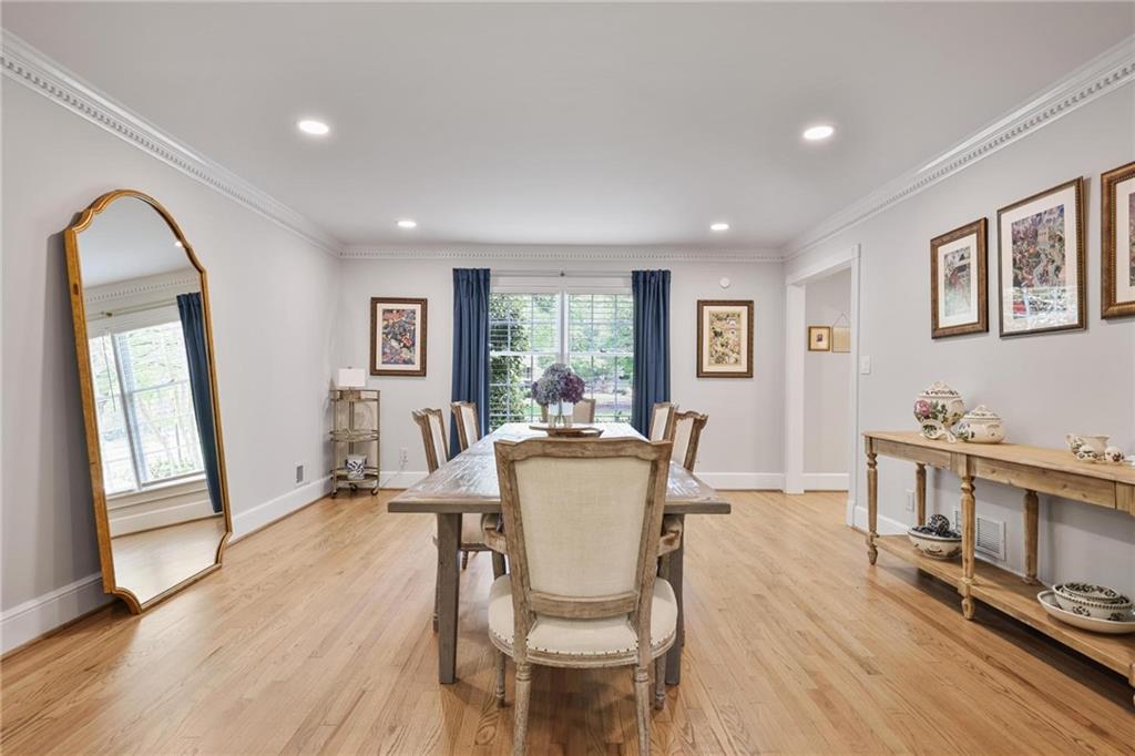 7680 Ryefield Drive Atlanta, GA 30350 - Photo 6 of 49 a dining room with furniture window and wooden floor