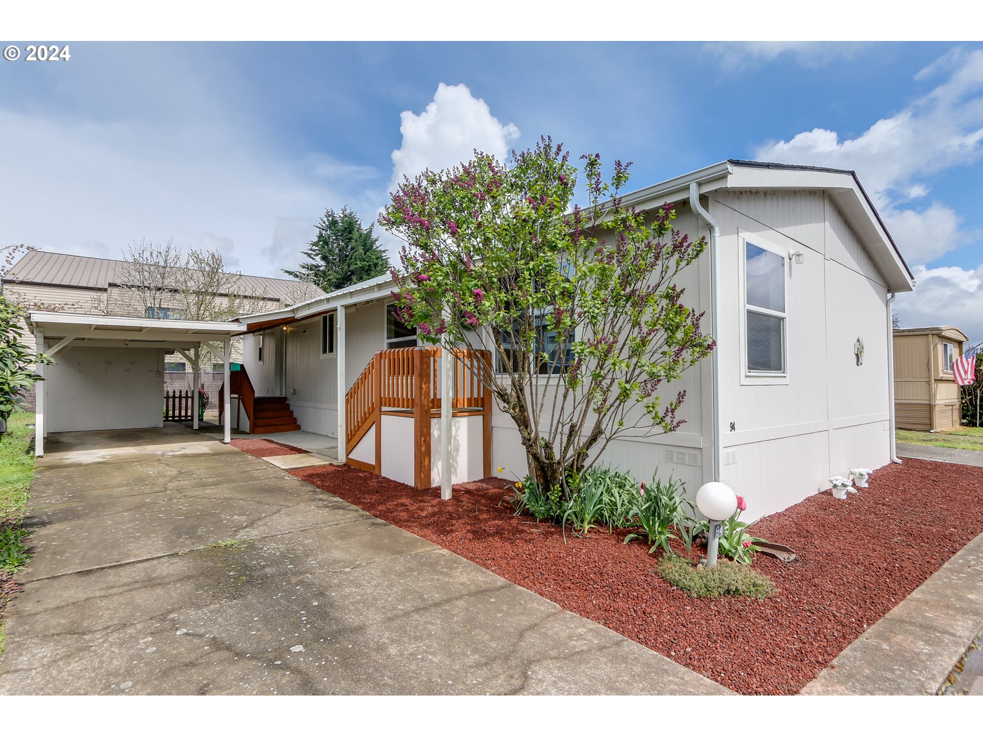 2150 Laura Street, Unit 94 Springfield, OR 97477 - Photo 2 of 28 a view of a house with a yard