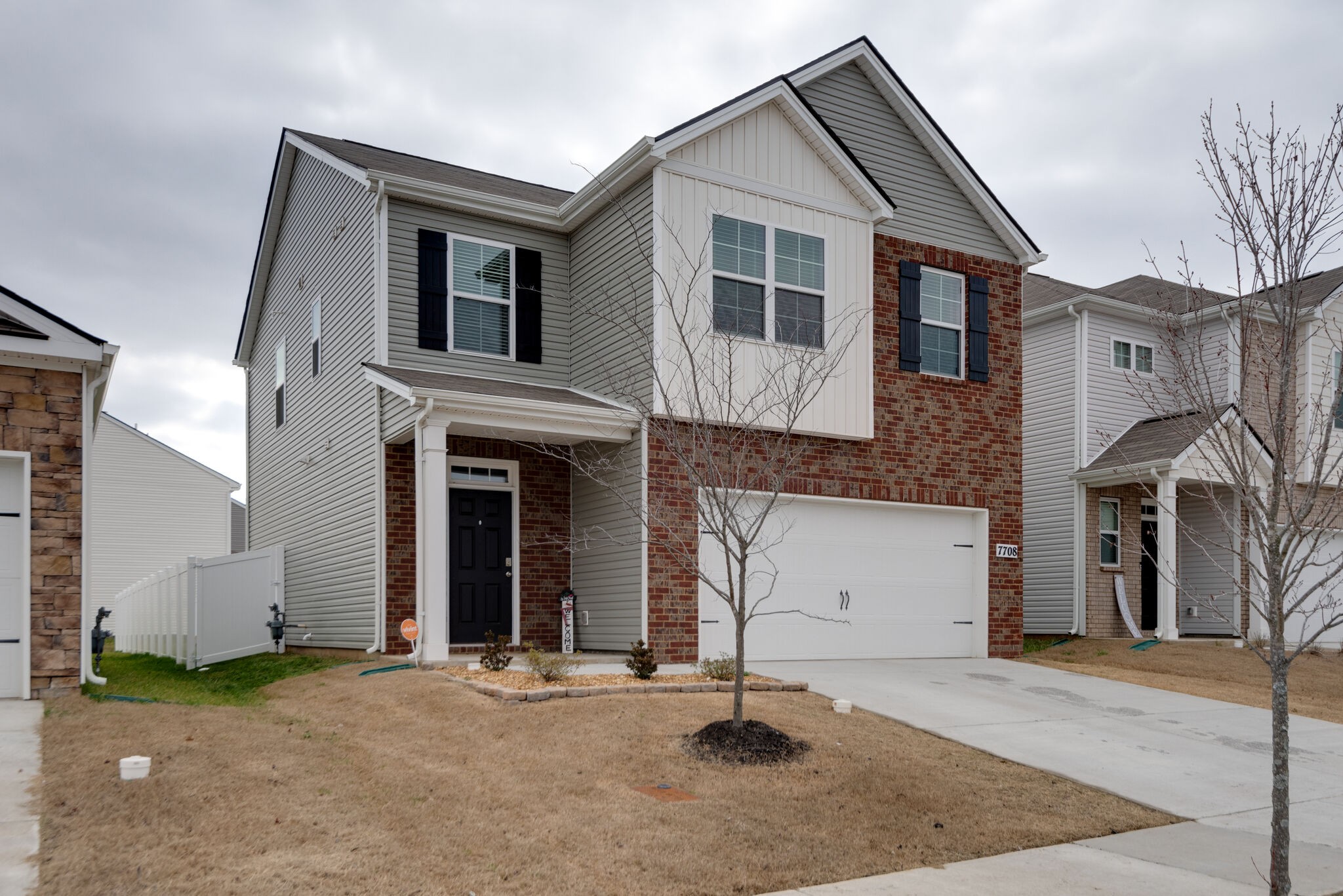 7708 Stapleton Chase Drive Antioch, TN 37013 - Photo 1 of 22 a front view of a house with a yard and garage