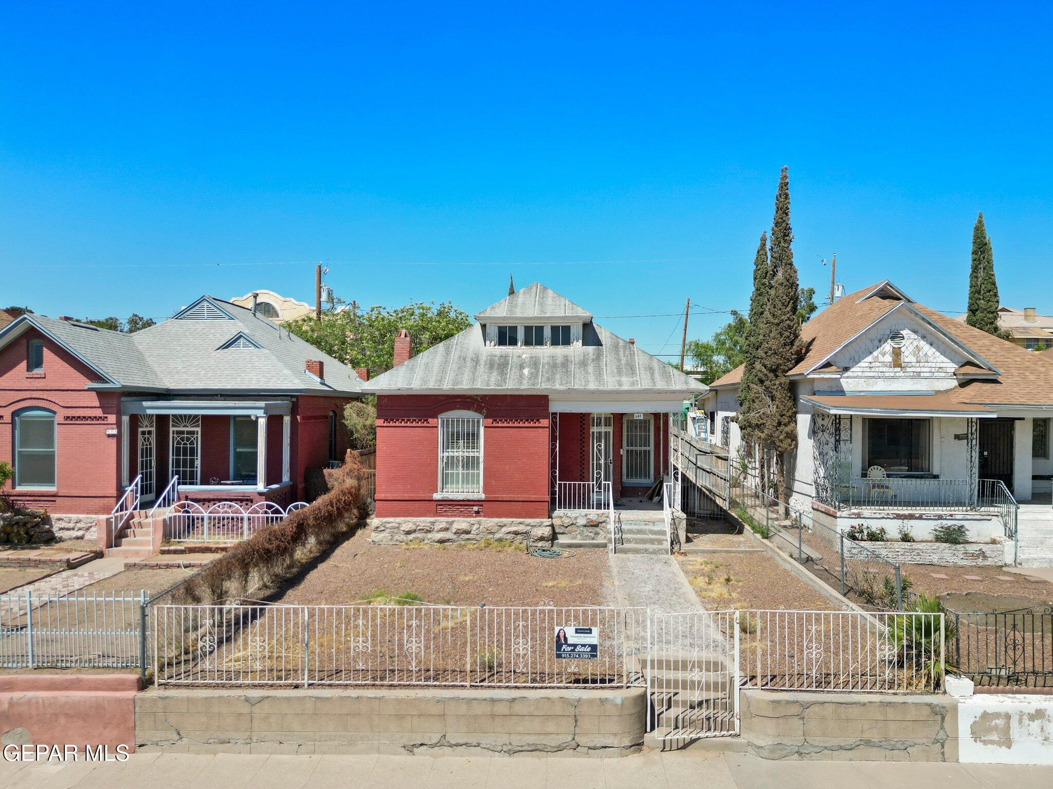 a front view of a house with yard