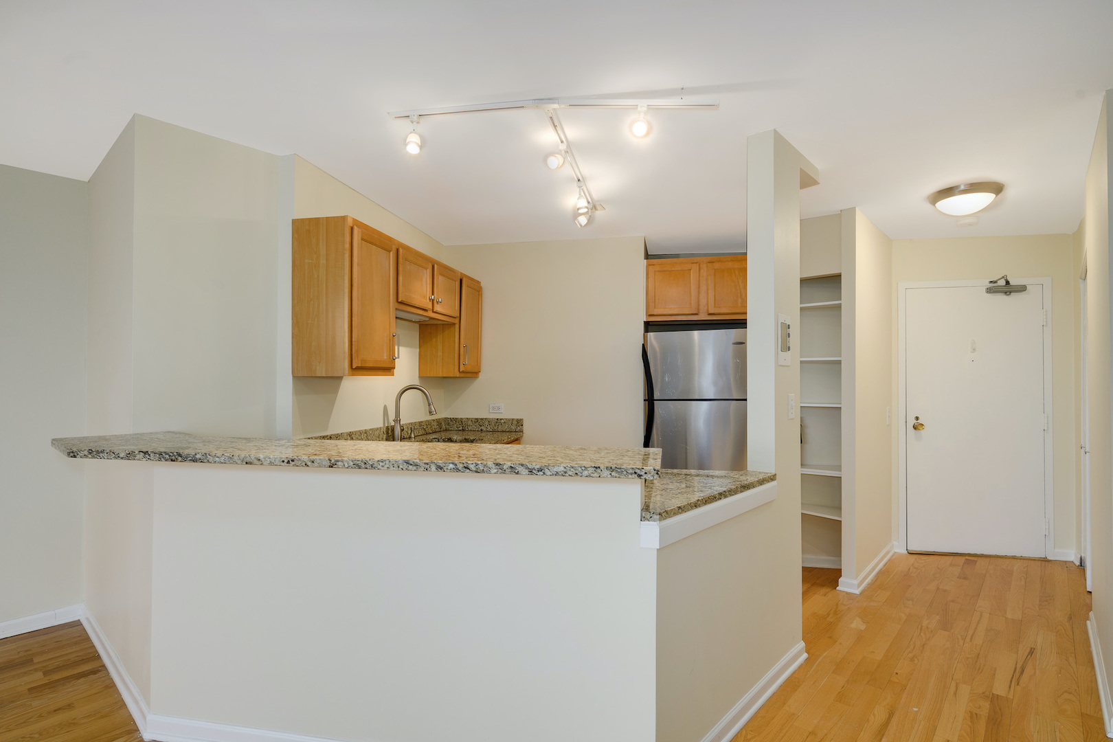 5415 North Sheridan Road, Unit 412 Chicago, IL 60640 - Photo 3 of 22 a bathroom with a granite countertop sink and a mirror