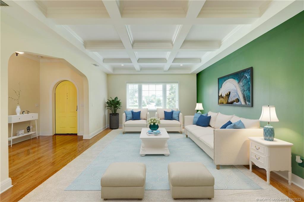 4865 Southeast Manatee Cove Road Stuart, FL 34997 - Photo 12 of 53 a living room with furniture and a large window
