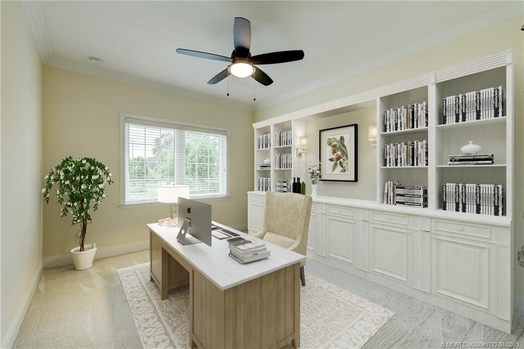 4865 Southeast Manatee Cove Road Stuart, FL 34997 - Photo 16 of 53 a living room with furniture and a table