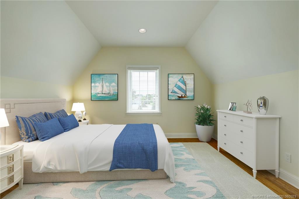 4865 Southeast Manatee Cove Road Stuart, FL 34997 - Photo 17 of 53 a spacious bedroom with a bed and window