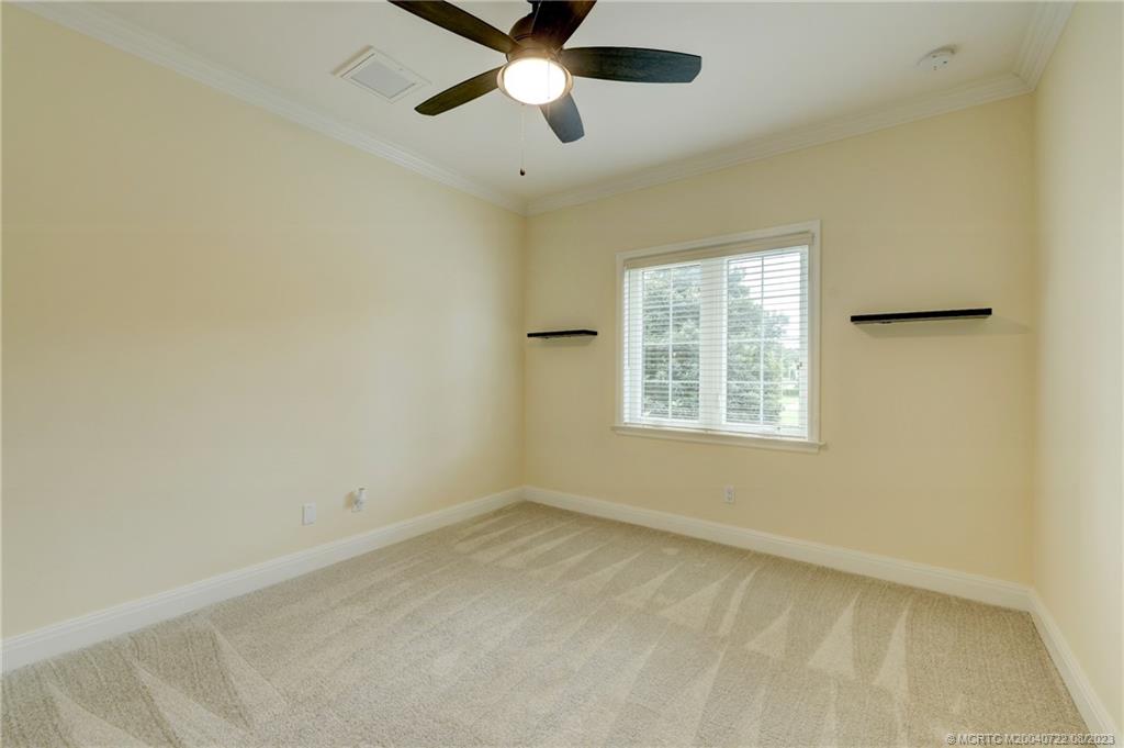 4865 Southeast Manatee Cove Road Stuart, FL 34997 - Photo 35 of 53 a view of an empty room with a window