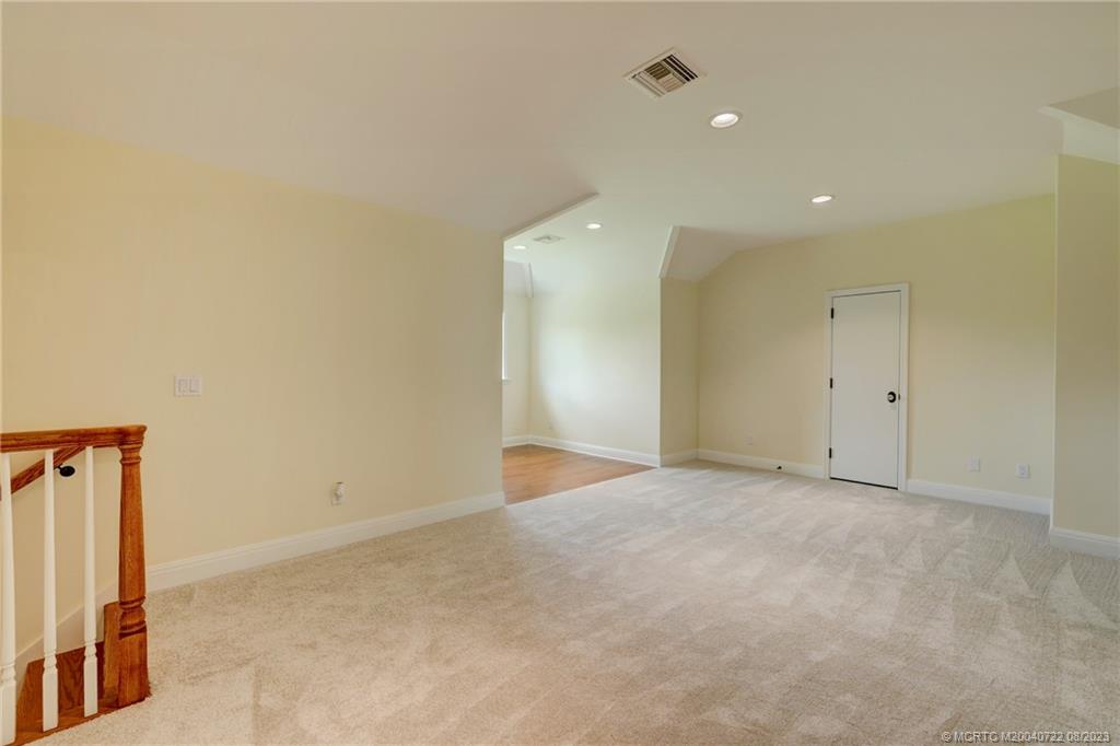 4865 Southeast Manatee Cove Road Stuart, FL 34997 - Photo 40 of 53 an empty room with closet and mirrors