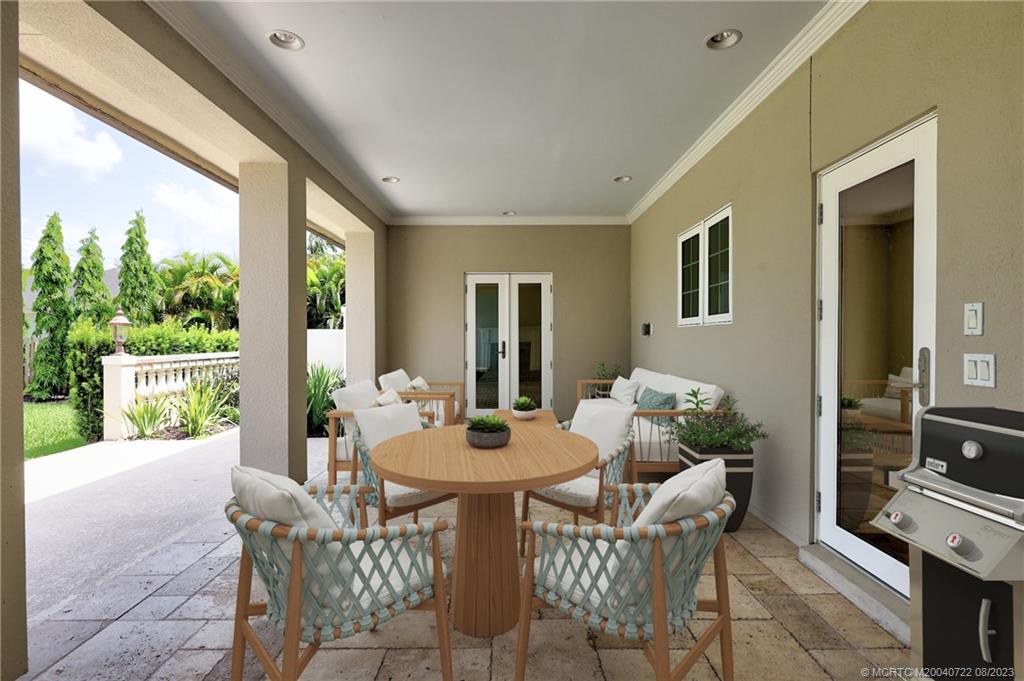 4865 Southeast Manatee Cove Road Stuart, FL 34997 - Photo 4 of 53 a dining room with furniture and window