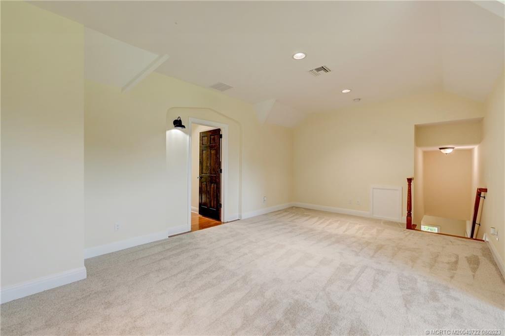 4865 Southeast Manatee Cove Road Stuart, FL 34997 - Photo 41 of 53 a view of an empty room