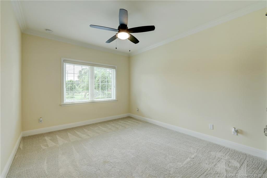 4865 Southeast Manatee Cove Road Stuart, FL 34997 - Photo 45 of 53 an empty room with a window