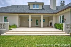 4865 Southeast Manatee Cove Road Stuart, FL 34997 - Photo 10 of 53 a view of a house with a swimming pool