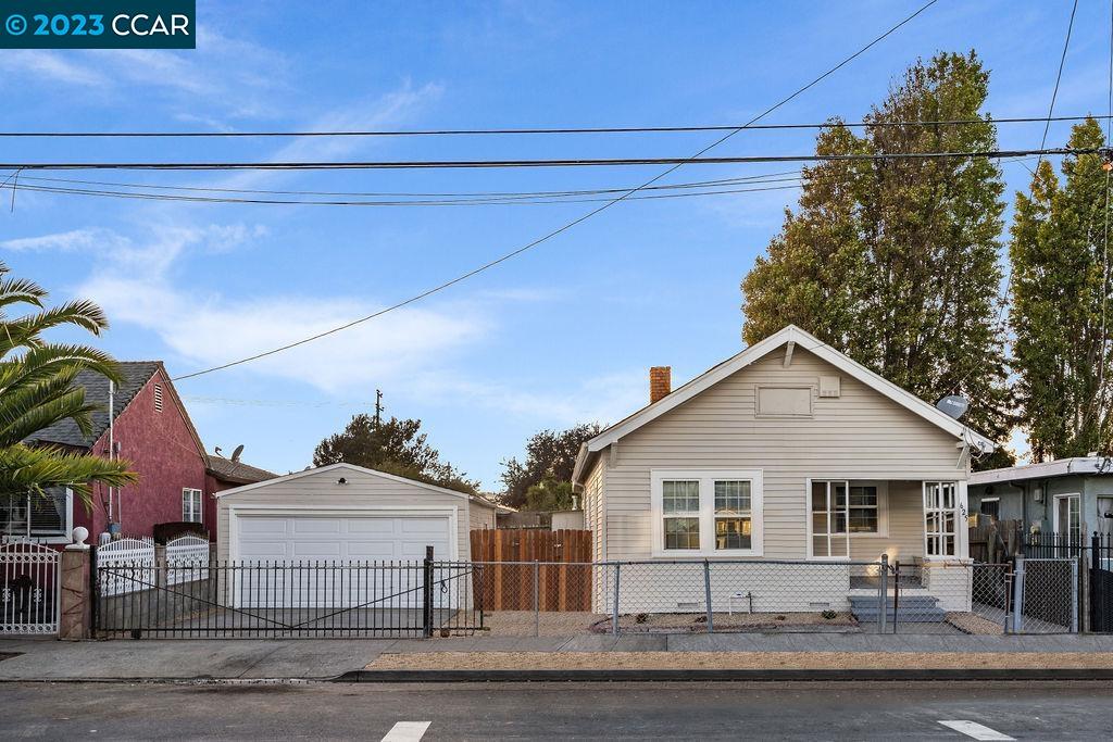 625 3rd Street Richmond, CA 94801 - Photo 1 of 1 a front view of a house with a yard