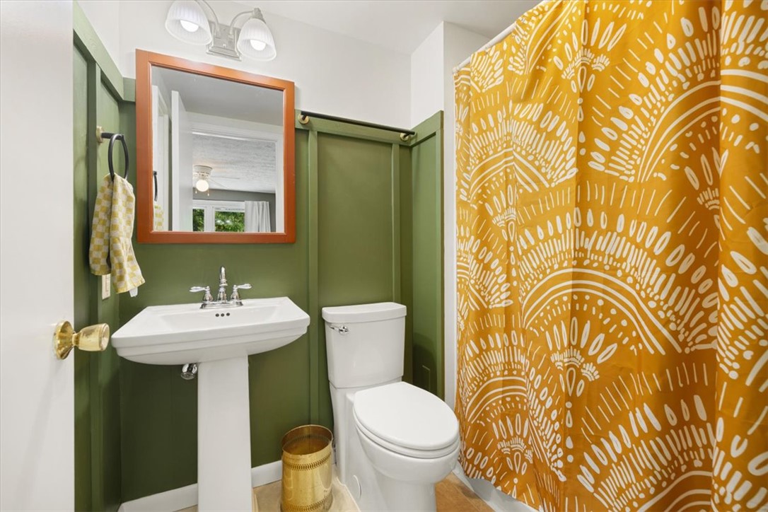 5120 Wheelock Road Troy, OH 45373 - Photo 35 of 67 This bright bathroom features a pedestal sink and modern fixtures, creating a refreshing atmosphere.