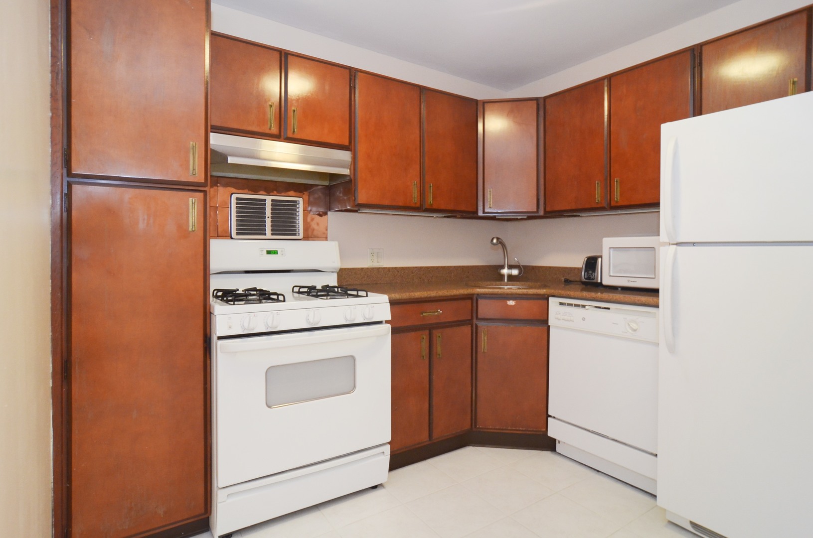 400 East Randolph Street, Unit 3404 Chicago, IL 60601 - Photo 2 of 35 a kitchen with a refrigerator sink and cabinets