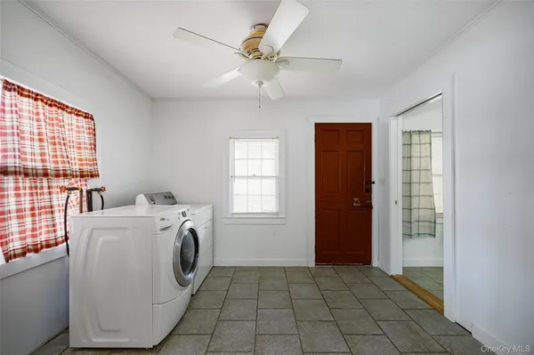 a view of a storage & utility room with washer and dryer