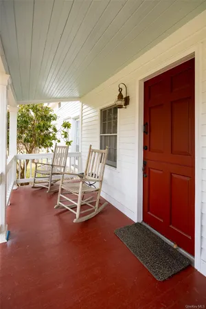 a dining room with furniture and windows
