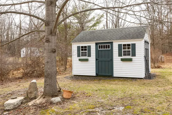 a house that has a tree in front of it