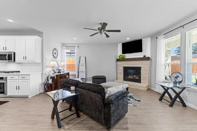 a living room with furniture and a fireplace