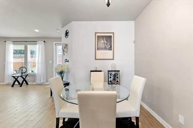 a view of a livingroom with furniture and a potted plant
