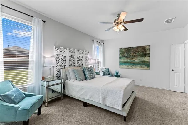 a bedroom with a bed and a couch