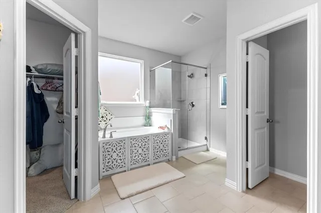 a bathroom with a shower and a sink