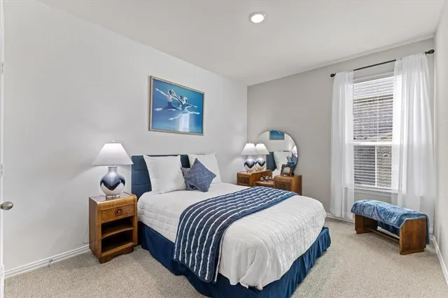 a bedroom with a bed and a couch