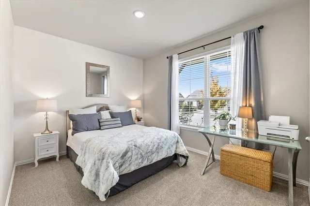 a bathroom with a double vanity sink toilet and a mirror