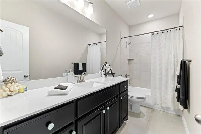 a room with furniture and a book shelf