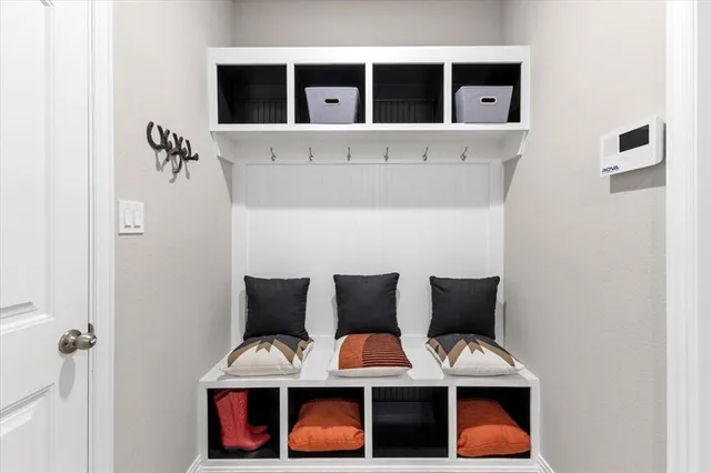 a view of storage and utility room with washer and dryer