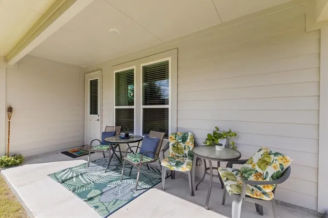 an aerial view of a house with swimming pool garden view and a yard