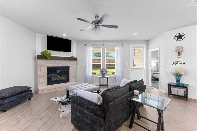 a living room with furniture fireplace and flat screen tv